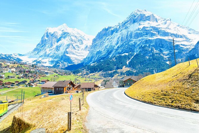 Day trip to Swiss Villages from Zurich - Small Group Tour by Car - Grindelwald: cobblestones, chalet scenes, and the Eiger–Mönch–Jungfrau trio