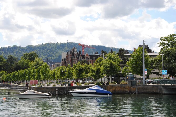 Zurich 360° City Walk Tour Including Hidden Spots - St. Peter’s Church and Münsterhof: clocks, Roman traces, and legend-wrapped corners