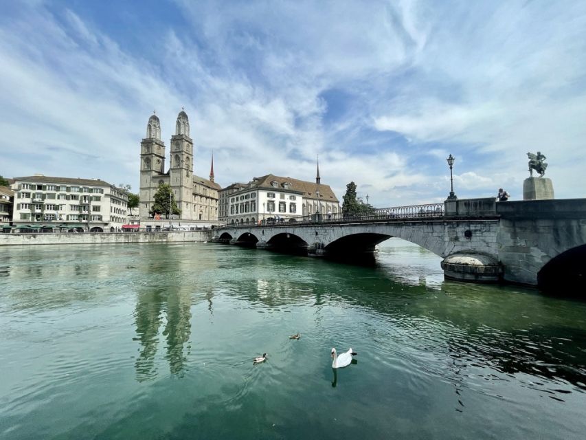 Zurich: City Sightseeing Tour with Lake Cruise - Old Town walking tour: guild houses, churches, squares, and guide stories