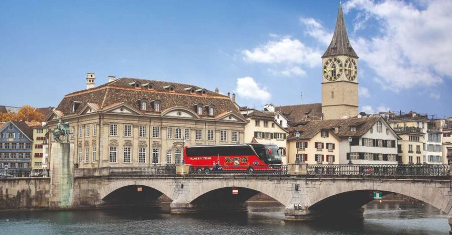 Zurich: City Top Attractions Tour by Bus with Audio Guide - Bahnhofstrasse, the banking center, and lake views with snowy peaks