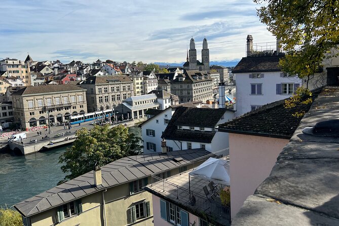 Zurich Food Tour with 10 Local Delicacies, Cheeses & Chocolates - Stop 2 at Zwinglipl. 7: Grossmünster Views and Faith Meets Food